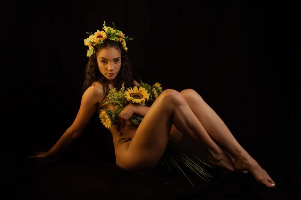 AndromedaZareth is hiding her body behind flowers, show off her long legs