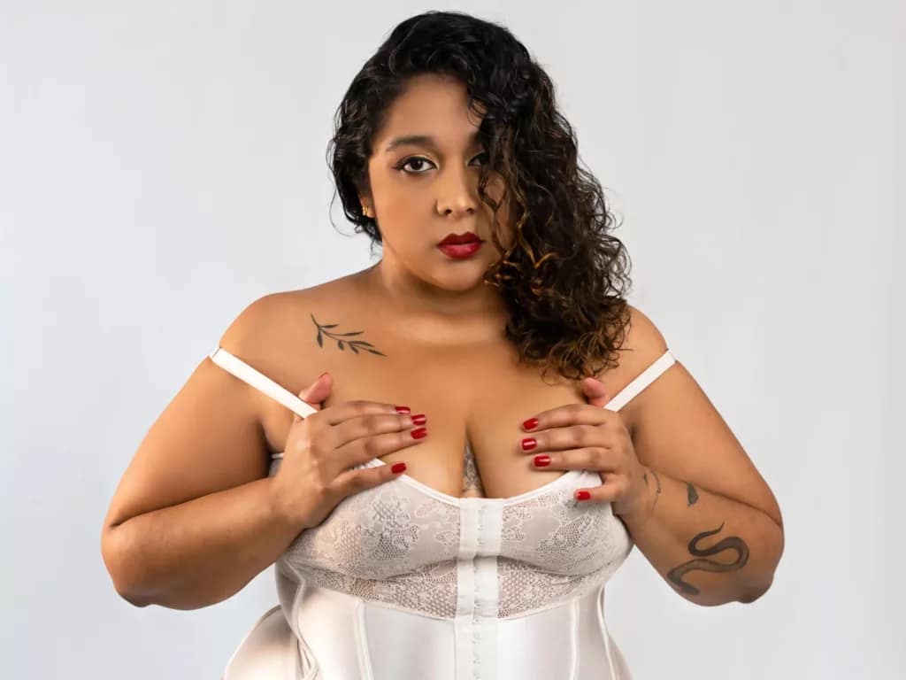 ViickyLee flaunting BBW huge boobs, playful smirk, swinger party invitation