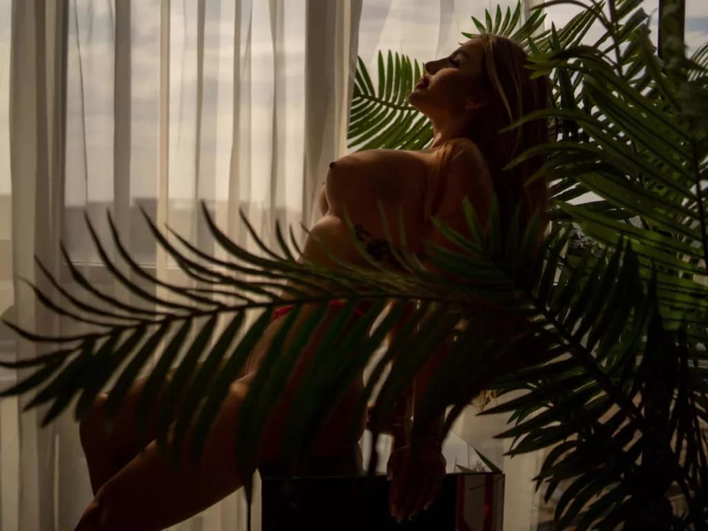 AshleySinnX mermaid vibes, curvy silhouette, palm tree, sunlit sensuality